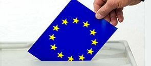 mano introduce nell'urna scheda per votare i membri del parlamento europeo